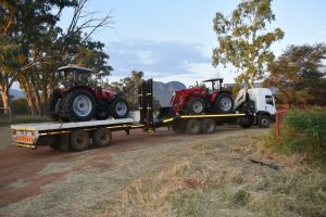 A picture that will make any farmer's heart race with joy: Two of Louis van der Walt's new Massey Ferguson tractors arrive at Spitskop Boerdery just before sunset.