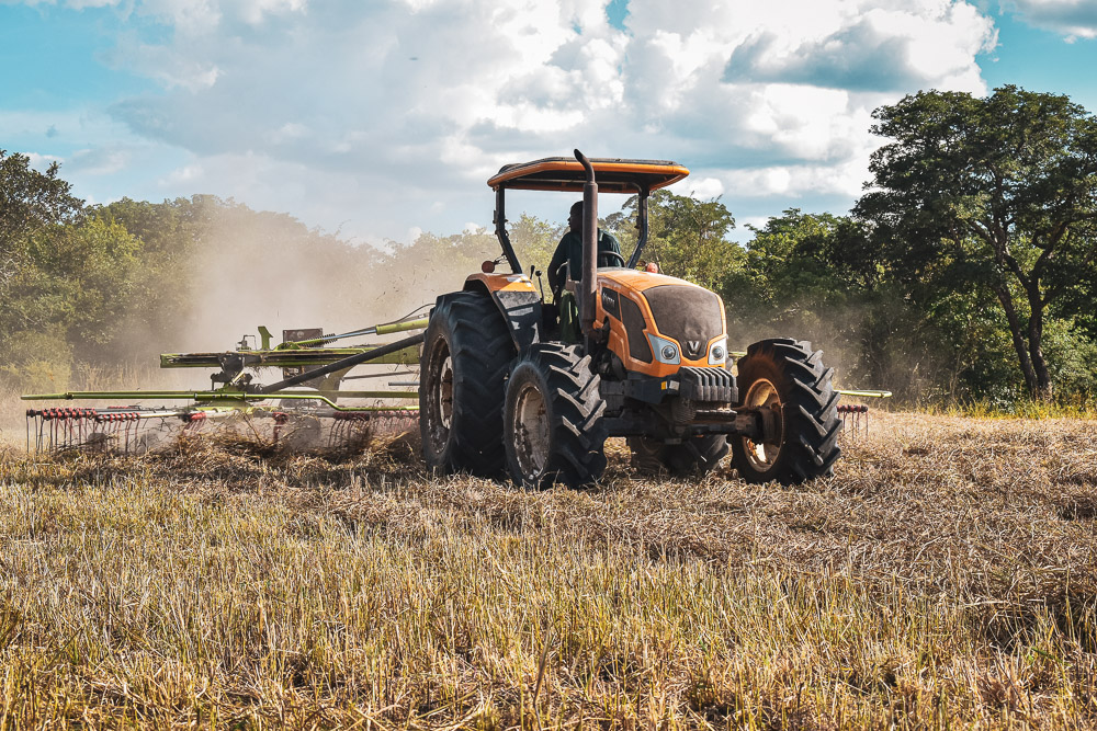 Valtra A750 raking hay